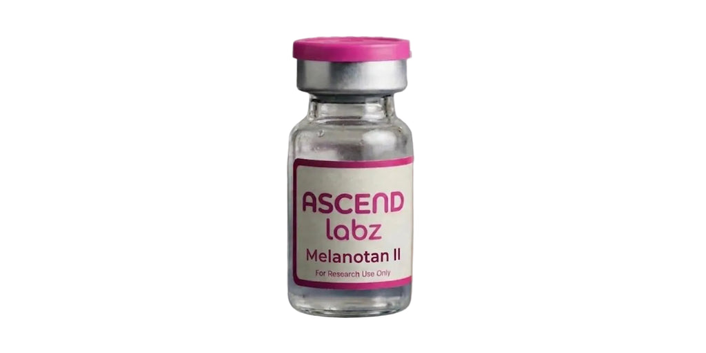 A small clear glass vial with a metallic silver cap and a pink and white label reading 'ASCEND labz Melanotan II' on a plain white background.